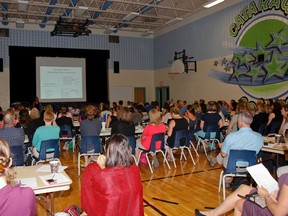 A large group of Limestone District School Board teachers and other educational staff head back to school early to participate in a professional development training session to learn tools and techniques to deal with chronic and childhood stress in their students, held at Cataraqui Woods Elementary School on Wednesday.(Julia McKay/The Whig-Standard)