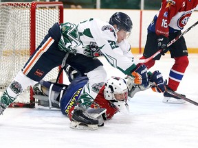 Rayside Balfour Canadians goalie Owen Johannson scrambles for the save as Elliot Lake Wildcats Roman Luppov reaches for the puck during NJOHL exhibition game action from the Gerry McCrory Countryside Sports Complex in Sudbury, Ont. on Thursday August 25, 2016. Gino Donato/Sudbury Star/Postmedia Network