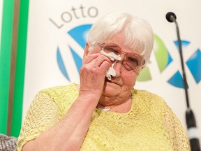 Mary Wernicke becomes emotional during a cheque presentation at DoubleTree hotel in Regina, Sask., on Thursday Aug. 25, 2016. Wernicke won $60 million on the Aug. 12 Lotto Max draw. THE CANADIAN PRESS/Michael Bell