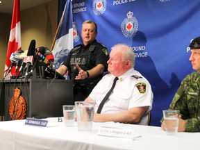 West Region Emergency Response Team Sgt. Pete Fischer, left, speaks at a press conference at the Owen Sound police station on Friday, August 19, 2016 in Owen Sound, Ont. Sgt. Fischer addressed the media at a joint press conference that included Owen Sound Police Service Chief Bill Sornberger, center, and 4th Canadian Division Training Centre Meaford commander Lt.-Col. Christian Lillington, right, about the discovery of the body of Pte. Andrew Fitzgerald, who disappeared early Saturday morning in Owen Sound. (James Masters/The Owen Sound Sun Times/Postmedia Network)