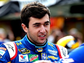 Chase Elliott, driver of the #24 NAPA Auto Parts Chevrolet, stands on the grid during qualifying for the NASCAR Sprint Cup Series Bass Pro Shops NRA Night Race at Bristol Motor Speedway on Aug. 19, 2016. (Jerry Markland/Getty Images)