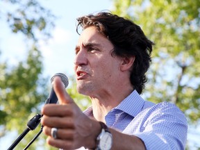 Prime Minister Justin Trudeau addresses the crowd at  a community barbecue in Sudbury, Ont. on Monday August 22, 2016.Justin Trudeau and his ministers wrapped up a two-day cabinet retreat in Sudbury at Laurentian University, where the ministers bunked together in student dorms. Gino Donato/Sudbury Star/Postmedia Network