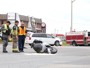 Greater Sudbury Police, Fire Services and EMS were on the scene of a collision involving a van and motorcycle on Regent Street in Sudbury, Ont. on Wednesday August 24, 2016.  Regent Street from Caswell Drive to Paris Street was closed to vehicular and pedestrian traffic for a few hours.  The 52-year-old male motorcycle operator received serious injuries. He is currently in stable condition. The collision remains under investigation as police continue to interview witnesses. Gino Donato/Sudbury Star/Postmedia Network