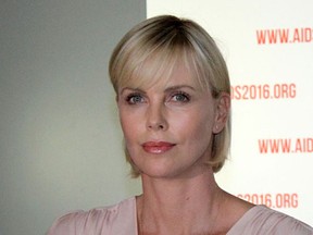 South Africa actress Charlize Theron looks on as she attends the first official press conference of the 21st International Aids Conference in Durban on July 18, 2016.  (AFP PHOTO/AFP/Getty Images)