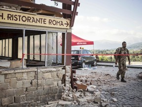 This picture taken on Wednesday, Aug. 24, 2016 shows the crumbling hulk of the Hotel Roma in  Amatrice, central Italy, where a strong quake had hit a few hours earlier. Strong aftershocks rattled residents and rescue crews alike Friday, Aug. 26, 2016, as hopes began to dim that firefighters would find any more survivors from Italy's earthquake. (Massimo Percossi/ANSA via AP)