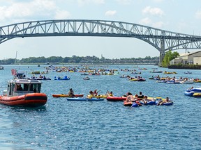 Sarnia received international news media attention earlier this week when an estimated 1,500 Americans were washed ashore to the Canadian side of the St. Clair River during Sunday's annual Port Huron Float Down event. Almost all of the American visitors were without passports, identification or even cash, and had to be returned to the American side of the border on Sarnia City Transit buses, 19 of which were used for the duty. Chief Petty Officer Lauren Jorgensen/U.S. Coast Guard