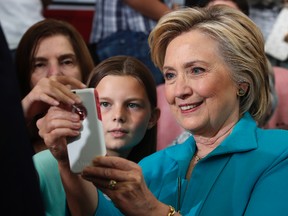 Democratic presidential candidate Hillary Clinton takes cellphone photos with people in the audience at a campaign event at Truckee Meadows Community College in Reno, Nev., Thursday, Aug. 25, 2016. (AP Photo/Carolyn Kaster)