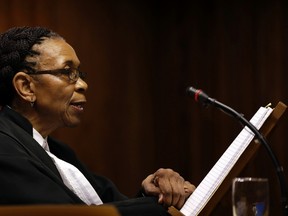 Judge Thokozile Masipa, reads her verdict during the state appeal hearing at the high court in Johannesburg, South Africa,Friday, Aug. 26, 2016. (AP Photo/Themba Hadebe/POOL)