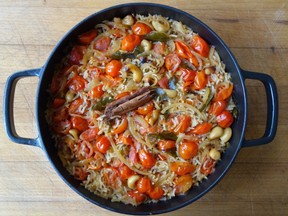 This July 2016 photo shows tomato and coconut rice in London. This dish is from a recipe by Meera Sodha.