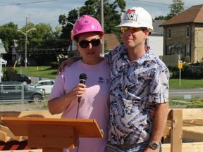 Terri and George Jones thank the crowd for their support of Habitat for Humanity Durham as they stand on the foundation of what will be their new home.