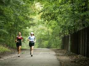 Jacqui Rutledge and Rebecca Blight head out for their long run on the Springbank Park paths in London. (MIKE HENSEN, Free Press file photo)