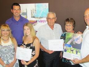 Organizers of Reanna's Float for Hope handed out a donation to Make-A-Wish Southwestern Ontario and a scholarship to a SCITS graduate Friday afternoon. Pictured here are Denise D'Eon, mother of the late Reanna Pyne; fundraiser organizer Kevin VanReenen; scholarship recipient Taylor Adams; Make-A-Wish volunteers Brian and Judy Latam; and Eric Parsons, owner of Sarnia's Coffee Culture locations. (Barbara Simpson/Sarnia Observer)