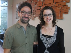 Cristian Medina, left, and Joana Lincho, at the Kingston Community Health Centres in Kingston on Friday, are involved in helping immigrant and refugee children successfully adapt to Canadian schools. (Michael Lea/The Whig-Standard)