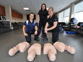 Sarah Campbell, Elaina Feyginberg and Anita Horlings of Rescue 7 offered two CPR and AED training sessions at Georgian Chevrolet on  Saturday in Barrie. (Mark Wanzel Photo)