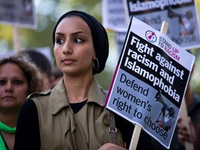 A woman wearing a headscarf joins a demonstration organised by "Stand up to Racism" outside the French Embassy in London on August 26, 2016 against the Burkini ban on French beaches.(JUSTIN TALLIS/AFP/Getty Images)