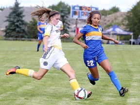 Laurentian Voyageurs womens soccer team forward Lindsay Hummelbrunner battles for the ball with Bernadette Francisci of the Ryerson Rams during season opener OUA action from Laurentian University in Sudbury, Ont. on Friday August 26, 2016. Gino Donato/Sudbury Star/Postmedia Network