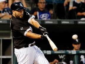 Dioner Navarro of the Chicago White Sox hits a sacrifice fly against the Seattle Mariners at U.S. Cellular Field on Aug. 25, 2016. (Jon Durr/Getty Images)