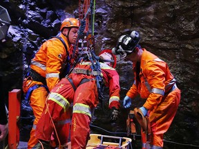 Members of the KGHM Sudbury Basin Cobras mine rescue team take part in a rope rescue event at Dynamic Earth during the International Mines Rescue Competition in Sudbury, Ont. on Thursday August 25, 2016. Gino Donato/Sudbury Star/Postmedia Network