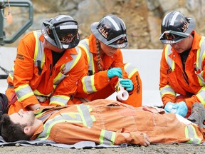 Members of the Vale West Mines mine rescue team take part in a simulated mine emergency and first aid event at the 114 orebody during the International Mines Rescue Competition in Sudbury, Ont. on Tuesday August 23, 2016. Gino Donato/Sudbury Star/Postmedia Network
