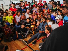 Tristan Thompson posing for a photo with kids inside the community centre in Brampton (Daniel McKenzie/Toronto Sun/Postmedia Network)