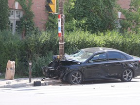 A car hit a pole at the corner of Roselawn and Avenue Rds. on Saturday August 27, 2016. Veronica Henri/Toronto Sun/Postmedia Network