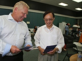 Raymond Cho, Progressive Conservative Party of Ontario candidate with co-campaign chair Doug Ford in the Scarborough-Rouge River byelection on Thursday, August 25, 2016. Veronica Henri/Toronto Sun/Postmedia Network