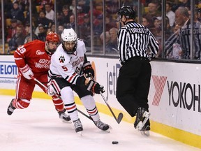 Matt Benning #5 of the Northeastern Huskies skates against J.J. Piccinich of the Boston University Terriers during the second period of the 2015 Beanpot Tournament Championship game at TD Garden on February 23, 2015 in Boston, Massachusetts.