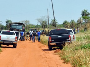 Police and soldiers remain on the site where eight Paraguayan soldiers were killed in the morning in an ambush with an IED (Improvised Explosive Device) presumably by members of the EPP leftist guerrilla, near Arroyito, 500 km north of Asuncion, on August 27, 2016. Eight Paraguayan soldiers died Saturday in a roadside explosion occurred on a rural road near the village of Arroyito, the government said. (AFP PHOTO / JAVIER CARDOZO / Paraguay OUTJAVIER CARDOZO/AFP/Getty Images)