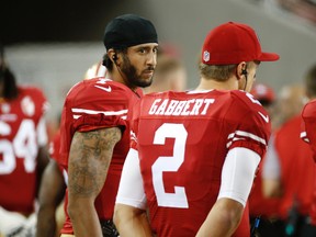 San Francisco 49ers quarterbacks Colin Kaepernick and Blaine Gabbert stand on the sideline during a game against the Green Bay Packers on Aug. 26, 2016. (AP Photo/Tony Avelar)
