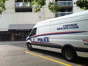 A forensic identification van was parked outside 323 Colborne st. on Sunday, Aug. 28, 2016 after police found a dead body in a unit. Azzura Lalani/The London Free Press/Postmedia Network