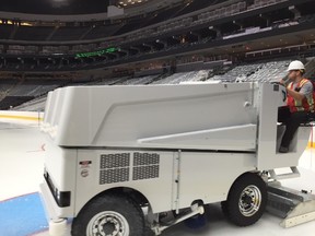 After the ice had been installed to a certain thickness, the Zambonis were brought out to build up the final layers of ice to a total thickness of 1 1/2 inches. (Jeff Nash, OEG)