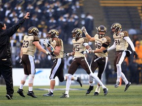 Western Michigan Bronco players celebrate after defeating the Toledo Rockets 35-30 at Glass Bowl on Nov. 27, 2015 in Toledo, Ohio. (Andrew Weber/Getty Images)