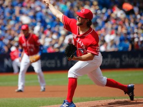 Blue Jays starting pitcher R.A. Dickey wore red on Sunday as part of Canada Baseball Day at the Rogers Centre. (MICHAEL PEAKE/TORONTO SUN)