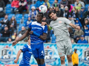 Edmonton's Pape Diakite challenges a Puerto Rico player for the ball during Sunday's game at Clarke Stadium. (Shaughn Butts)