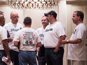 Members of Unifor, the Canadian Auto Workers Union, are seen before a meeting with General Motors Canada in Toronto on Wednesday August 10, 2016. THE CANADIAN PRESS/Aaron Vincent Elkaim