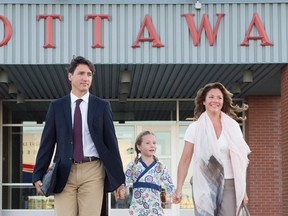 Prime Minister Justin Trudeau, his wife Sophie Gregoire, and daughter Ella-Grace board a government plane in Ottawa, Monday August 29, 2016. THE CANADIAN PRESS/Adrian Wyld