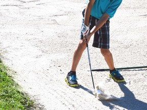 After a chip that came up slightly short, Coulter Rolph was left with a recovery shot from the bunker during action from the Mitchell Golf & Country Club’s junior club championship last Tuesday, Aug. 23. GALEN SIMMONS MITCHELL ADVOCATE