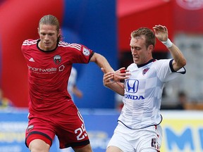Ottawa Fury FC's Lance Rozeboom, left, battles with Indy Eleven's Brad Ring, right, at TD Place. (Darren Brown, Postmedia Network)