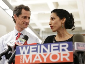 In this July 23, 2013 file photo, Huma Abedin, alongside her husband, then-New York mayoral candidate Anthony Weiner, speaks during a news conference in New York. Democratic presidential candidate Hillary Clinton aide Huma Abedin says she is separating from husband Anthony Weiner after another sexting revelation involving the former congressman from New York. (AP Photo/Kathy Willens, File)