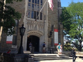 Students walk from Willard Straight Hall on the Cornell University campus in Ithaca, N.Y., Monday, Aug. 29, 2016. Ithaca College student Anthony Nazaire, of Brooklyn in New York City, was stabbed to death Sunday outside the hall following a student-organized gathering. (AP Photo/Carolyn Thompson)