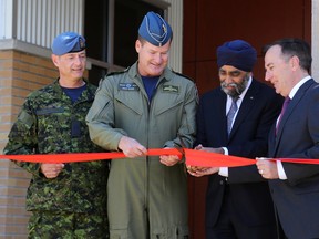 Emily Mountney-Lessard/The Intelligencer
From left, Lt. Gen. Michael Hood and CWO Gérard Poitras with defence minister Harjit S. Sajjan and Bay of Quinte MP Neil Ellis cut the ribbon during the official opening of the new Integrated Personnel Support Centre (IPSC) at 8 Wing Trenton, on Monday, in Trenton.