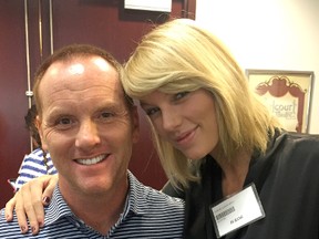 In this image provided by Bryan Merville, potential juror pop star Taylor Swift, right, poses for a photo with Bryan Merville in a courthouse waiting area in Nashville, Tenn., Monday, Aug. 29, 2016. A Nashville judge dismissed Swift as a potential juror in an aggravated rape and kidnapping case. Merville was dismissed as a potential juror in a separate case. Merville, who owns a technology infrastructure company, said he took a photo with Swift for his daughters, who are huge fans. (Bryan Merville via AP)
