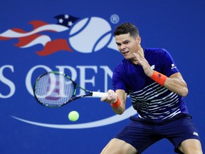 Milos Raonic of Canada returns a shot to Dustin Brown of Germany during their first round Men's Singles match on Day 1 of the U.S. Open at the USTA Billie Jean King National Tennis Center on Aug. 29, 2016. (Michael Reaves/Getty Images)