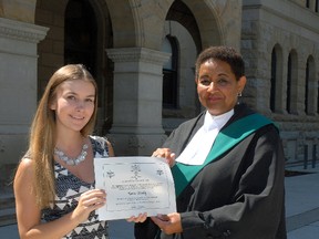 Parkside Collegiate Institute graduate Kerissa Woolley accepts a $1,000 bursary from Justice of the Peace Cheri Emrich on behalf of the Association of Justices of the Peace of Ontario. The St. Thomas teen was the West Region recipient of the bursary given to students who plan to pursue a career in the justice sector. Woolley’s accomplishments at Parkside were not limited to the academic stream as she excelled in badminton, tennis and volleyball.