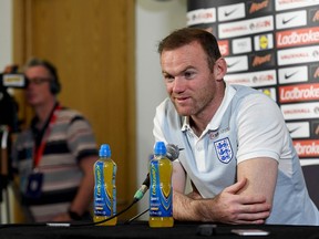 England captain Wayne Rooney speaks at a press conference at England's training camp in Burton-on-Trent, central England on August 30, 2016. (ANTHONY DEVLIN/AFP/Getty Images)