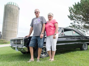 Roy, left, and Marion Taylor stand in front of their new 1967 Dodge Coronet 500 that they won during this year’s Moparfest in New Hamburg, Ontario. (Darryl Coote/Reporter)