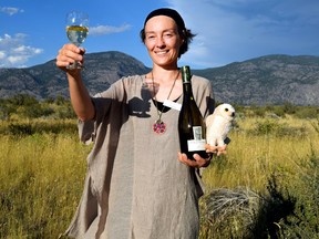 Burrowing Owl Winery ambassador Sophie Laurent hoists a glass of the brand's Pinot Gris at the Romancing the Desert fundraiser at the Osoyoos Desert Centre. STEVE MACNAULL/SPECIAL TO POSTMEDIA NETWORK
