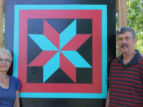 BRUCE BELL/the intelligencer
Pat and Ron Dubyk are pictured with a barn quilt in front of the County home. The pair started the Prince Edward County Barn Quilt Trail in 2013 and along with a team of volunteers now have close to 150 installed throughout the municipality.