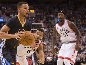 Warriors' Stephen Curry (left) drives past Raptors' Corey Joseph (6) as Terrence Ross (31) watches during NBA action in Toronto on Dec. 5, 2015. (Chris Young/The Canadian Press)