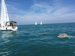 A boat trawling Lake Huron on August 20.